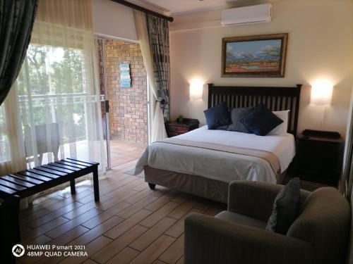 מיטה או מיטות בחדר ב-DuneSide Guest House