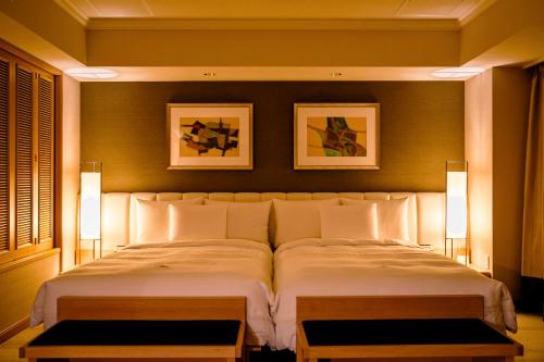 The Windsor Hotel Toya Resort & Spa tesisinde bir odada yatak veya yataklar