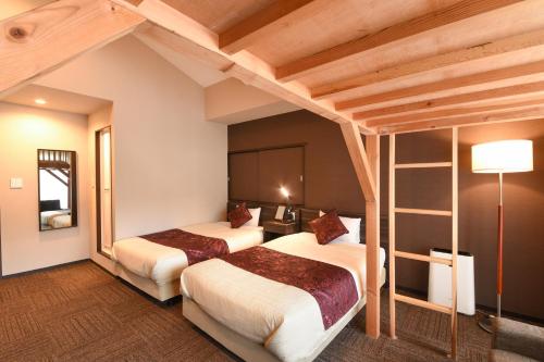 Un pat sau paturi într-o cameră la Arima Onsen Koki