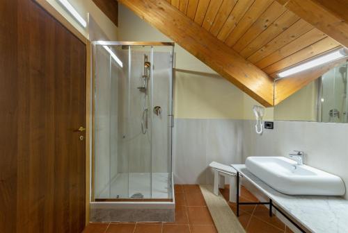 a bathroom with a shower and a sink at Villa Signorini Hotel in Ercolano
