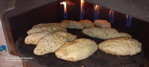 a group of bread being cooked in an oven at קטלב kta-love in Kammon