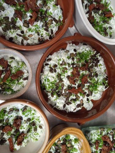 a group of bowls filled with different types of food at Gîte de Llo - Vue Pyrénées, chambres & PDJ inclus in Llo