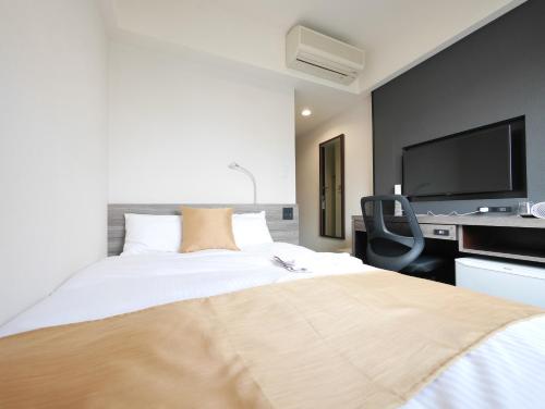 Кровать или кровати в номере Hotel Comfybed Ginza