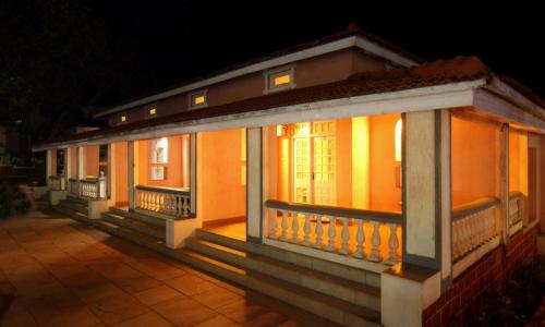 a row of houses with lights on them at night at The Byke Heritage Resort - Matheran in Matheran