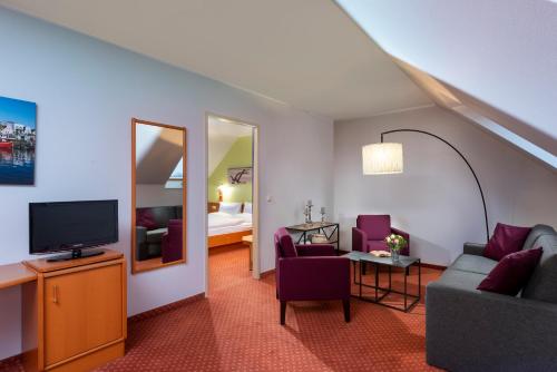 TV a/nebo společenská místnost v ubytování Hotel Godewind