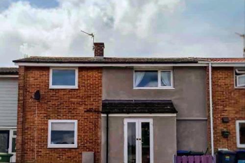 a red brick house with a roof at Jackson place in Newton Aycliffe