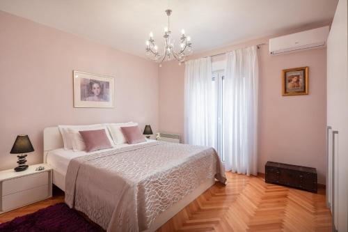 Posteľ alebo postele v izbe v ubytovaní Exclusive Center Apartments