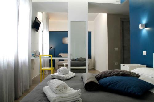 A bed or beds in a room at Central Rooms Matera