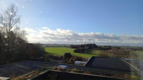 a view of a field from the roof of a house at Klintholm B & B Bistro in Borre