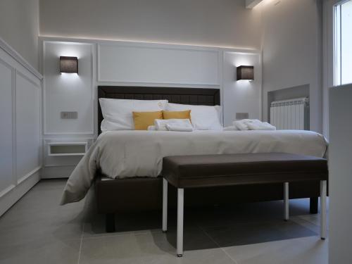 a bedroom with a large bed with yellow pillows at Golden Residence in Caianello