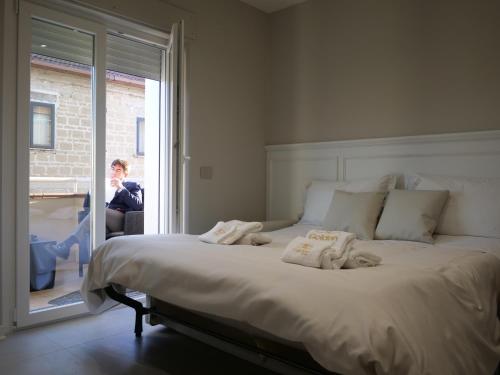 a bedroom with a large bed with towels on it at Golden Residence in Caianello