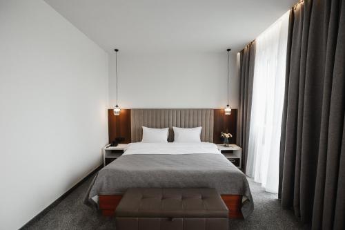 Postel nebo postele na pokoji v ubytování Victoria Palas Hotel