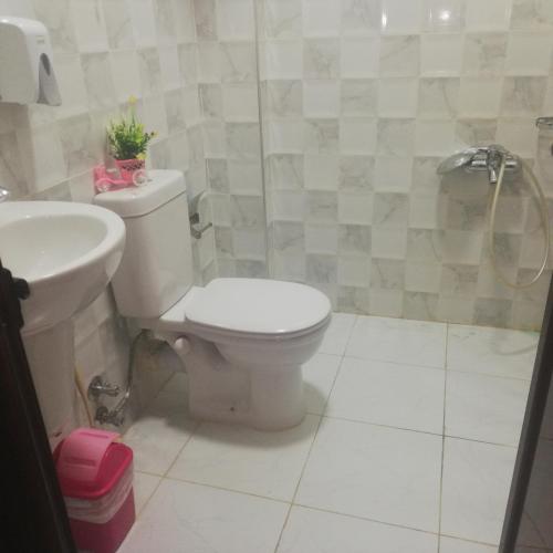 a bathroom with a toilet and a sink at Shabana House in Dahab
