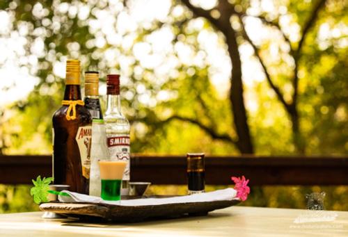 two bottles of alcohol sitting on a table at Elephant Plains Game Lodge in Sabi Sand Game Reserve