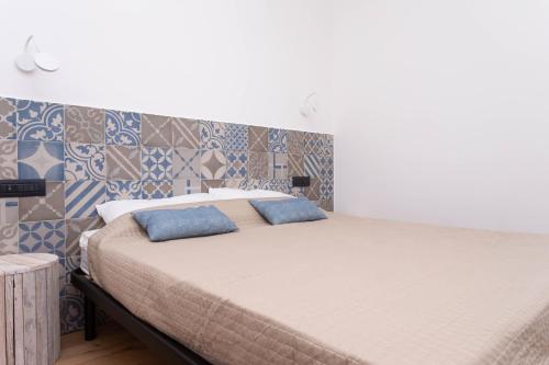 Postel nebo postele na pokoji v ubytování A06 - Massignano, meravigliosa camera con vista