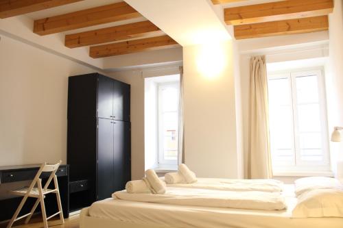 Postel nebo postele na pokoji v ubytování Trentino Apartments - Il Gufo Vacanze