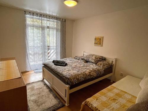 Postel nebo postele na pokoji v ubytování Apartmán & štúdio Tyrkys Spiežovec Donovaly