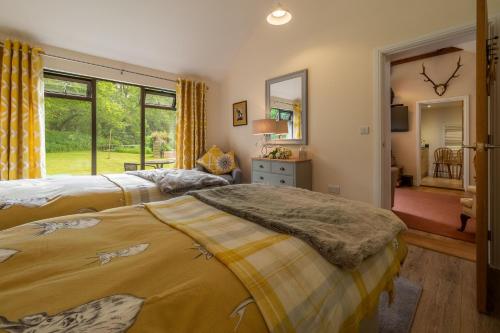 Кровать или кровати в номере The Lodge, Wherstead