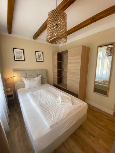 מיטה או מיטות בחדר ב-Hotel Sankt Georg