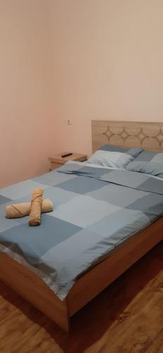 a bed with two pillows on top of it at шорена in Batumi