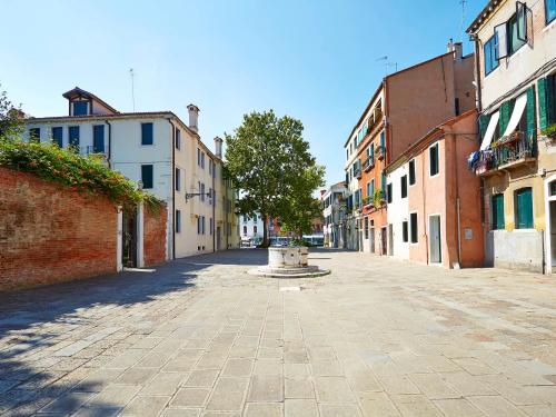 an empty street with a fountain in the middle at Canal Grande in Venice