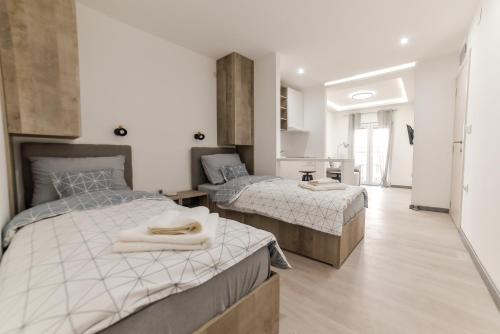 Postel nebo postele na pokoji v ubytování Apartmani Statik SD