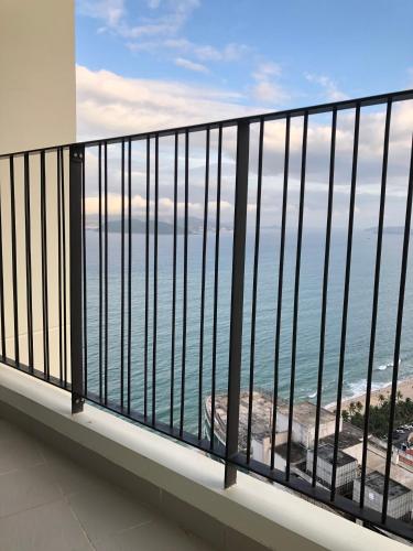 a balcony with a view of the ocean at Gold Coast Luxury Apartment Nha Trang in Nha Trang