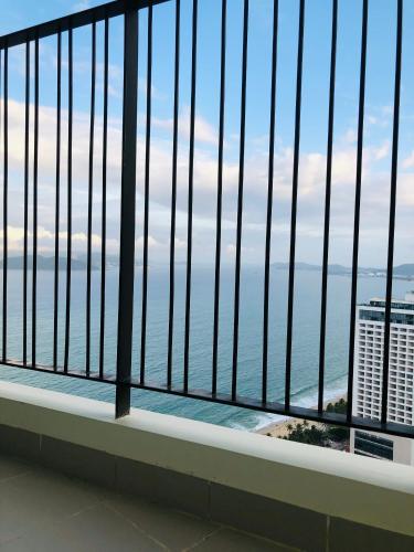 a balcony with a view of the ocean at Gold Coast Luxury Apartment Nha Trang in Nha Trang