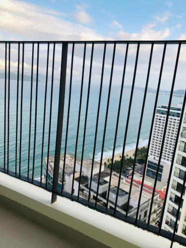 a balcony with a view of the ocean at Gold Coast Luxury Apartment Nha Trang in Nha Trang