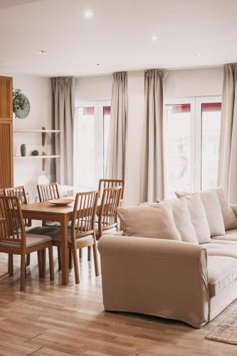 a living room with a couch and a table at Central and Cozy in Brussels in Brussels