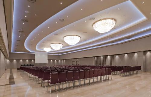 a conference room with chairs and lights on the ceiling at InterContinental Barcelona by IHG in Barcelona