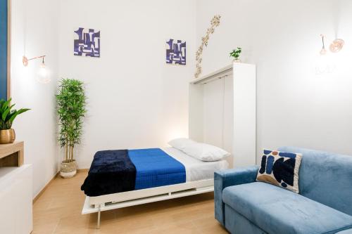 Postel nebo postele na pokoji v ubytování Palazzo Butera Cozy Studio Apartment
