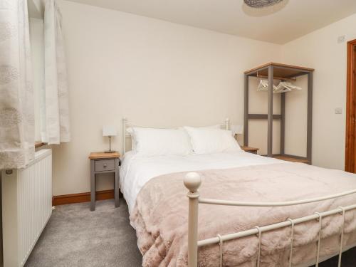 Cama ou camas em um quarto em Dawsons Cottage