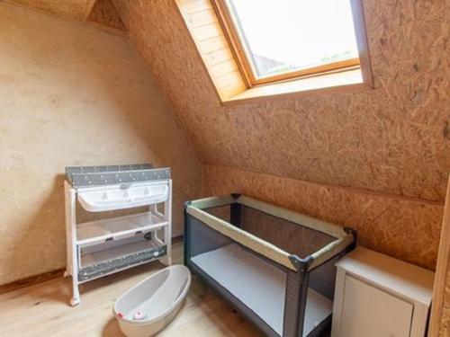 a bathroom with a toilet and a sink and a window at LES GRANGES D'ANTAN - La FORGE - in Chalonnes-sous-le-Lude