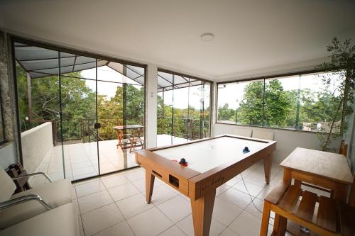 a large room with a pool table in it at Pousada nossas Raízes in Porto Velho