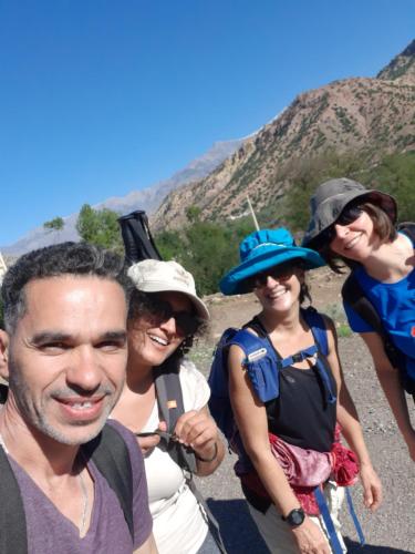 a group of people posing for a picture on a mountain at La maison des amis in Taroudant
