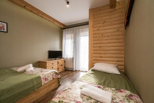 Posteľ alebo postele v izbe v ubytovaní Lux apartamenty Stara Polana