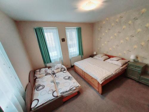 Postel nebo postele na pokoji v ubytování Apartmány Agáta Abertamy
