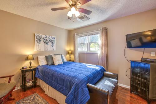 a bedroom with a bed and a ceiling fan at Beehive Condo in Lake Junaluska