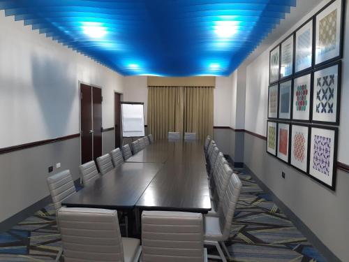 a conference room with a long table and chairs at Holiday Inn Express Trincity by IHG in Piarco
