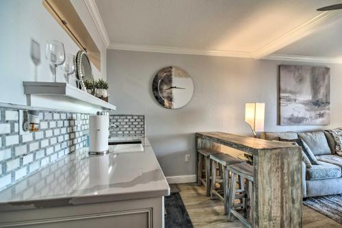 a kitchen and living room with a couch at Beachfront Clearwater Condo with Community Pool in Clearwater Beach