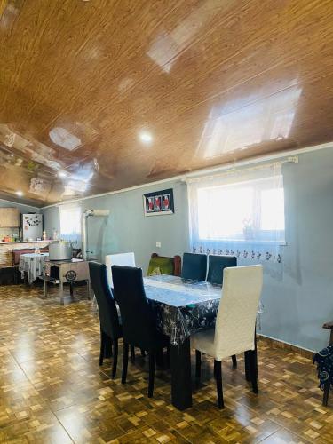 a dining room with a table and chairs at Mamuka's Guesthouse in Udabno