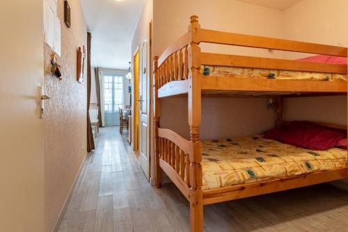 a hallway with two bunk beds in a room at La Tourette in Cauterets