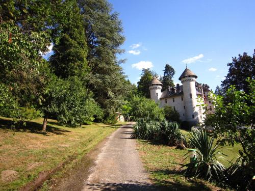 a castle in the middle of a dirt road at Cosy castle with pool in Serri res en Chautagne in Serrières-en-Chautagne