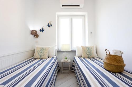 Ένα ή περισσότερα κρεβάτια σε δωμάτιο στο Casa Manì