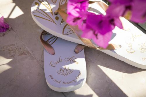 a plate of flowers and a plate of shoes at Corte Alma Spa and Luxury Home in Gargnano