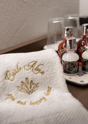 a towel with the words all me and myself written on it at Corte Alma Spa and Luxury Home in Gargnano