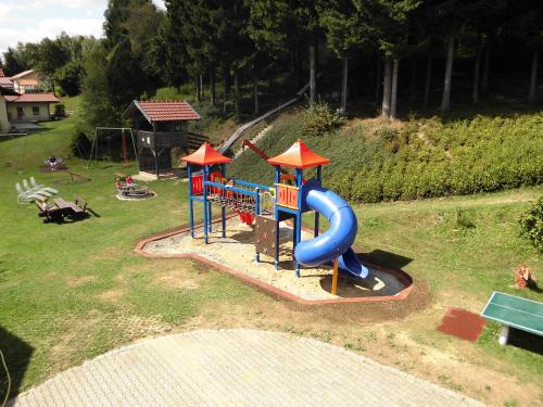 an aerial view of a playground with a slide at Erlebnishof Reiner - Urlaub auf dem Bauernhof in Sankt Englmar
