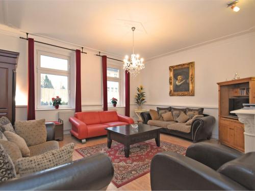 a living room with couches and a coffee table at Villa with home cinema sauna in Treuen