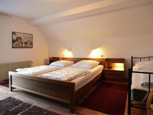 a bedroom with two beds in a room at Holiday home near the ski lift in Winterberg